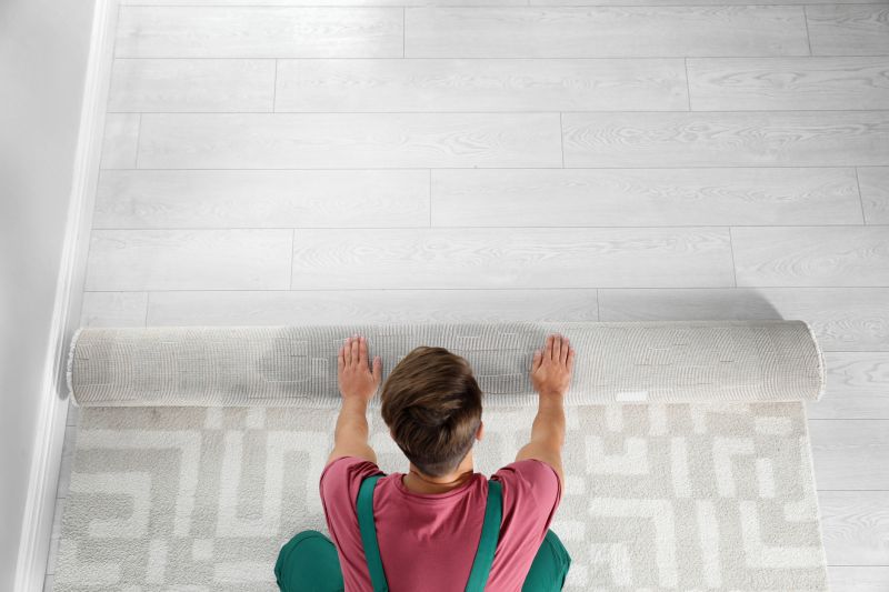 Professional Carpet Installer at Work